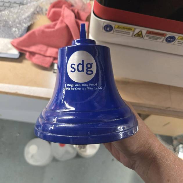 Laser engraved blue bell with company logo - Flameingo Forge
